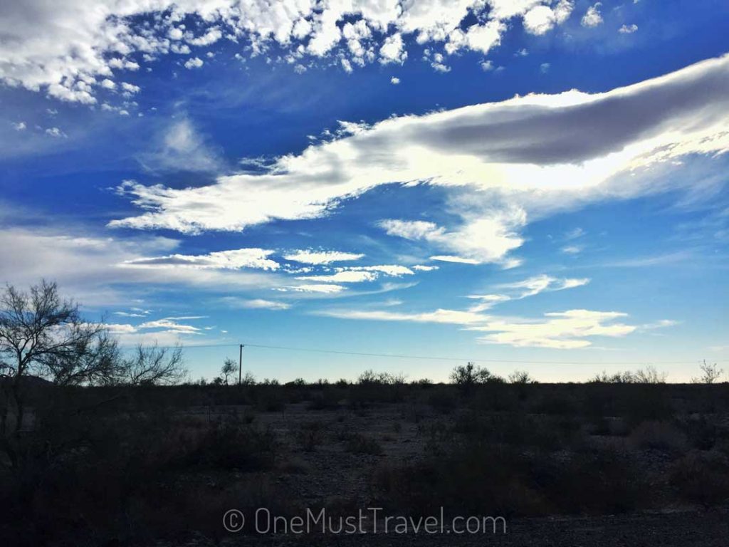 Fluffy clouds illuminated by the sun over the desert outside Yuma